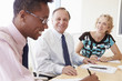 © Monkey Business - Three Businesspeople Having Meeting In Boardroom