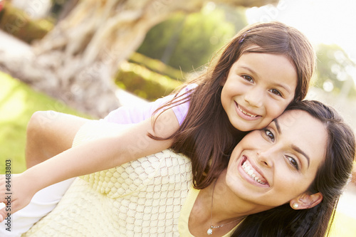 Fotografie, Obraz Portrait Of Hispanic Mother And Daughter In Park