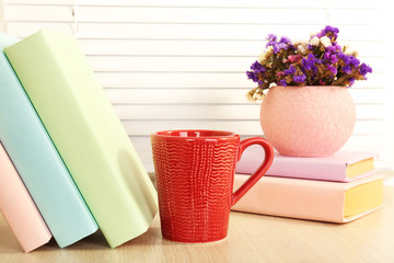 Sticker - Books, cup and plant on wooden windowsill, closeup