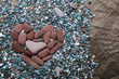Heart from sea color stones on crumpled black paper