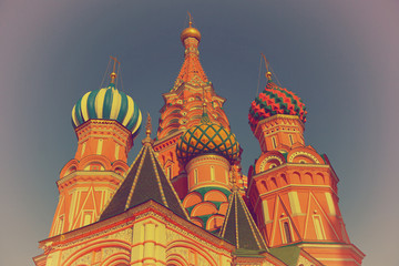 Multi-colored domes of the famous St. Basil's Cathedral in Moscow's Red Square in Russia. Photo in vintage style