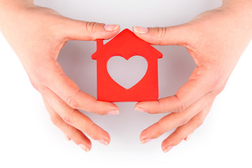 Canvas Print - Female hands with model of house isolated on white