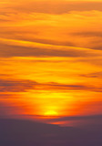 Fototapeta Zachód słońca - Bright sunset in cirrus fiery clouds - vertical nature backgroun
