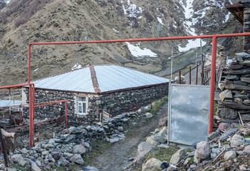 Canvas Print - Gergeti village near Stepantsminda town in Greater Caucasus Range, Georgia