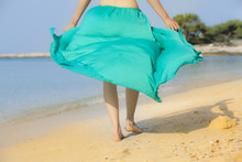 Barefooted Woman Walking On Beach