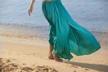 Barefooted Woman Walking On Beach