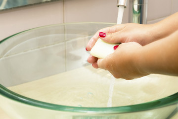 Wall Mural - Hands washing with soap under running water