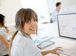 © goodluz - Portrait of young businesswoman working in office