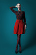 © alexbutscom - Elegant woman in red skirt