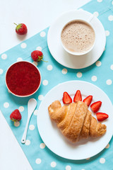 Wall Mural - traditional croissant french sweet dessert with a cup of coffee