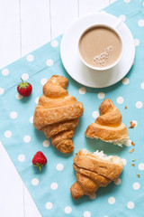 Wall Mural - two croissants traditional french pastry sweet dessert with a