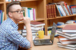 © Viacheslav Yakobchuk - Young student working in a library