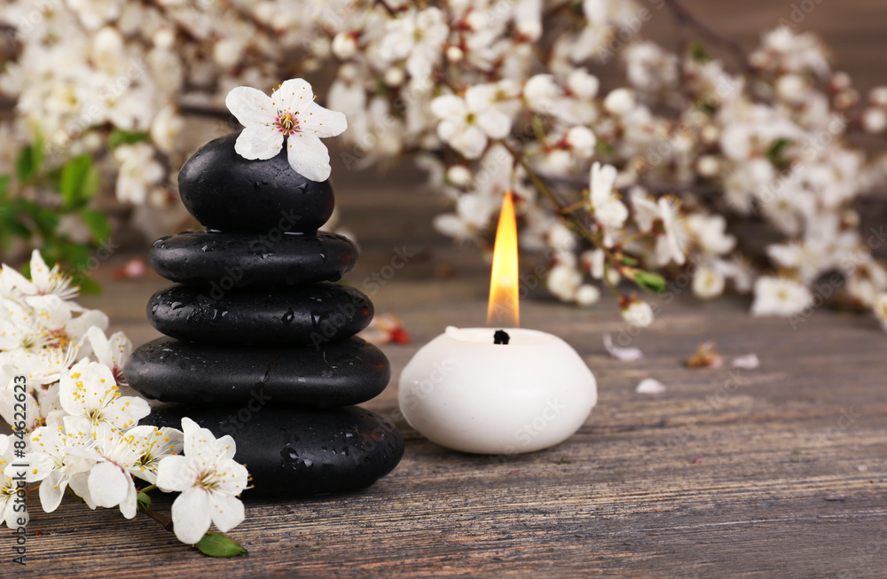 Spa still life with flowering branches on wooden background