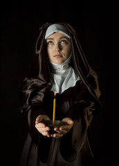 Canvas Print - Nun with candle.