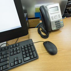 table work in office with telephone and computer pc