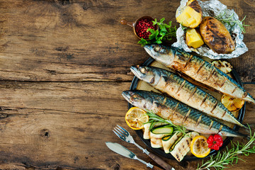 Wall Mural - Grilled mackerel fish with baked potatoes