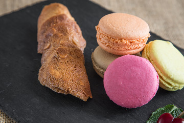 traditional french colorful macarons in a rows in a box