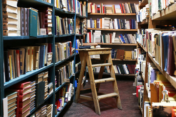 Poster - Many books on bookshelf in library