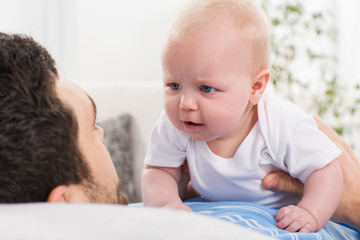 father playing with a baby