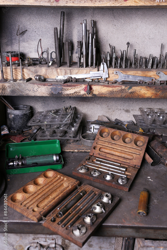 Different tools on workplace in garage