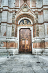 Wall Mural - wooden door in San Petronio cathedral in Bologna