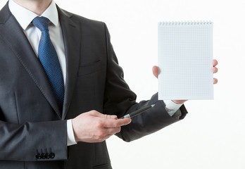 Wall Mural - Unrecognizable businessman holding an empty notebook and a pen