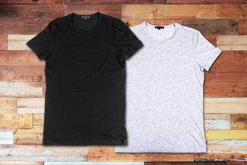 Blank t-shirts on a wooden surface