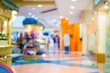 © patcharaporn1984 - Blurred image of shopping mall and bokeh background.