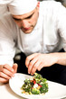© stockyimages - Cook decorating a broccoli salad