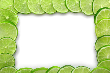 Canvas Print - Frame of sliced fresh limes isolated on white