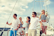 © Syda Productions - smiling friends sailing on yacht