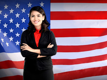 Business Woman Folding Hand Over USA Flag