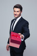 © Drobot Dean - Businessman giving gift box