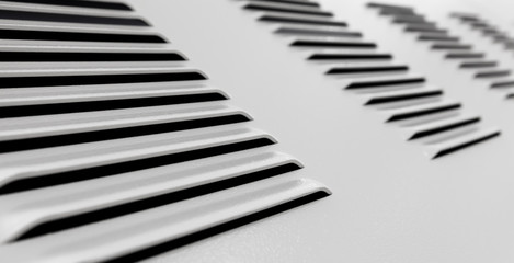 White metal industrial wall with ventilation grille