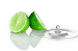 Two slices of lime with water drop
