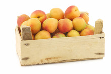 Fresh Colorful Apricots In A Wooden Box On A White Background