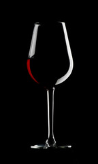 Wall Mural - Glass of red wine on dark background