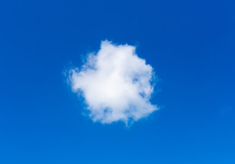 Single white cloud like circle against beautiful blue sky