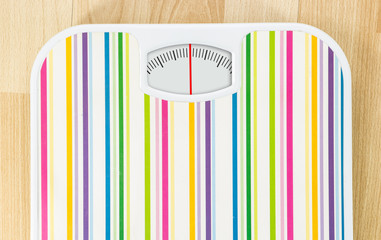 Poster - Bathroom scale with clean dial with lines no numbers on wooden floor