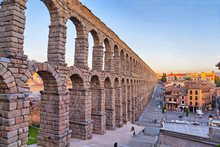Ancient Roman Aqueduct On Plaza Del Azoguejo Square In Segovia, Spain