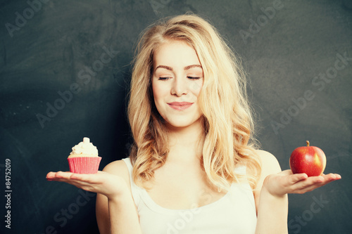 Fotografie, Obraz Woman with Healthy and Unhealthy Food. Difficult choice. Overwei
