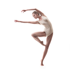 young beautiful dancer in beige swimsuit 