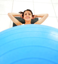 Young Woman, Exercises With A Core Ball