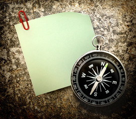 Blank green sticker and compass