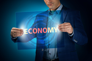 Businessman holding a transparent screen with an inscription a e