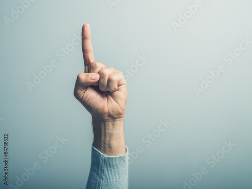 Fotomural Male hand with finger pointing up