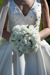 Wall Mural - Beautiful wedding bouquet in hands of the bride