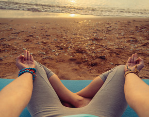 Canvas Print - POV image of woman meditating in pose of lotus