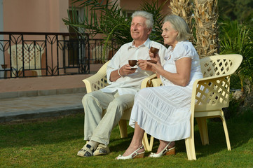 Senior Couple drinking tea in garden