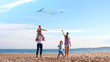 Family on Beach with Kite